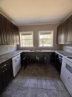Kitchen with dark brown cabinets, crown molding