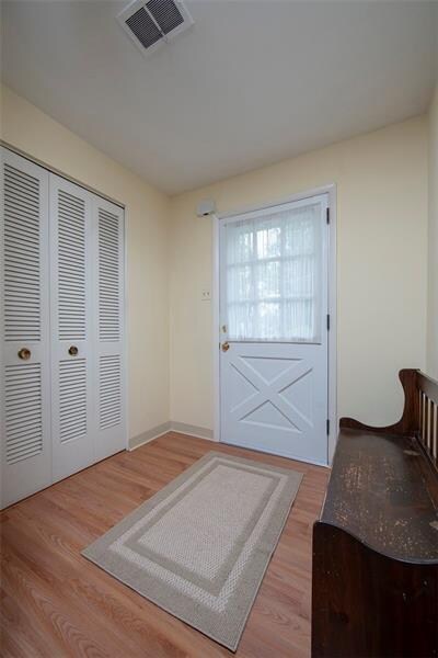 Entry features newer laminate flooring and a large