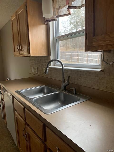 Nice cabinets, faucet and trendy back splash