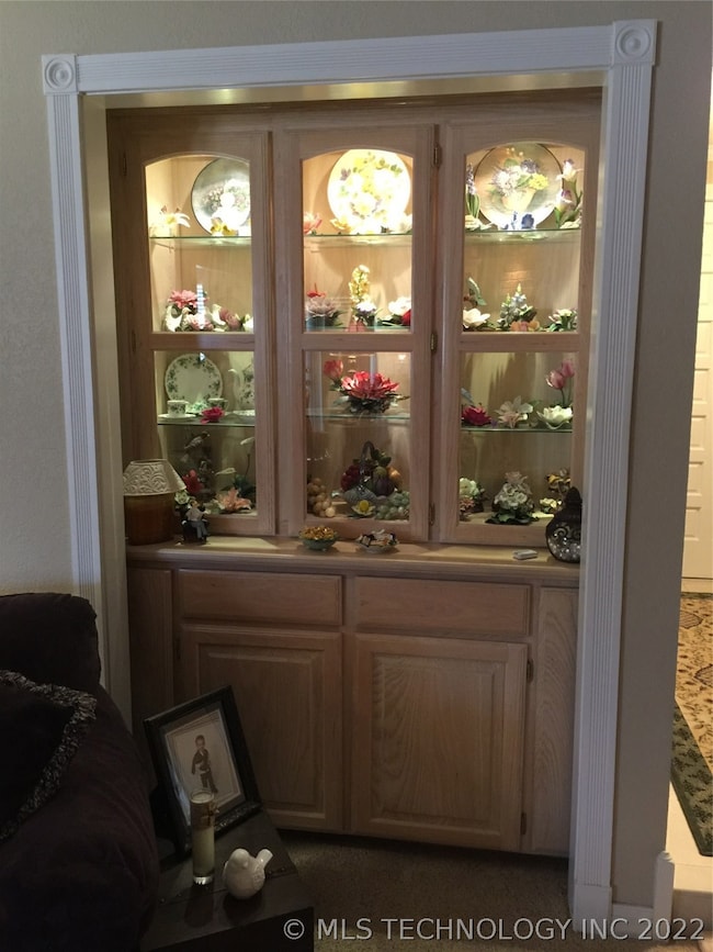 Custom built lighted display cabinet in living roo
