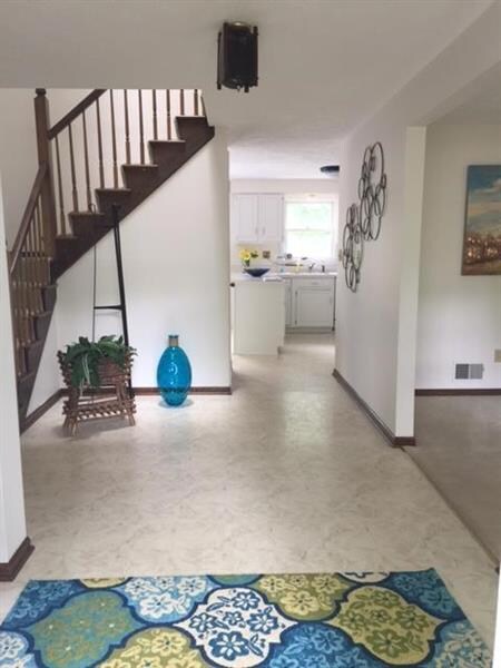 This beautiful, bright open entry greets you as yo