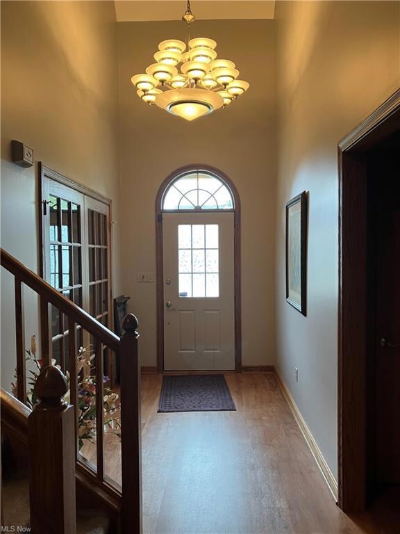 Entrance foyer featuring a chandelier and a high c