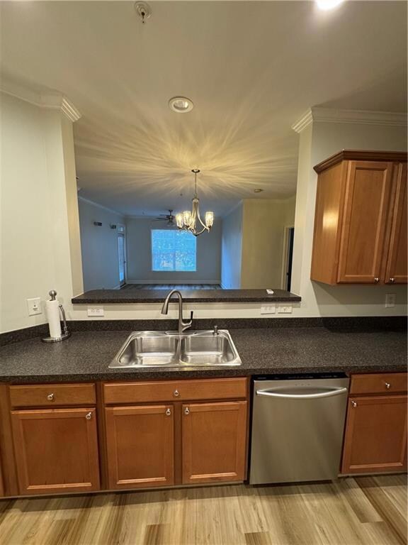 Kitchen with a sink, dark countertops, brown cabin