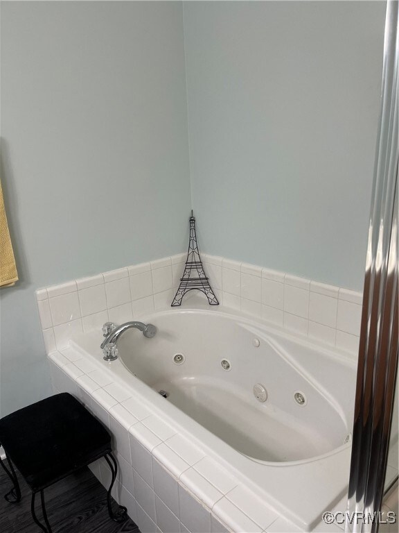 Bathroom with hardwood / wood-style flooring