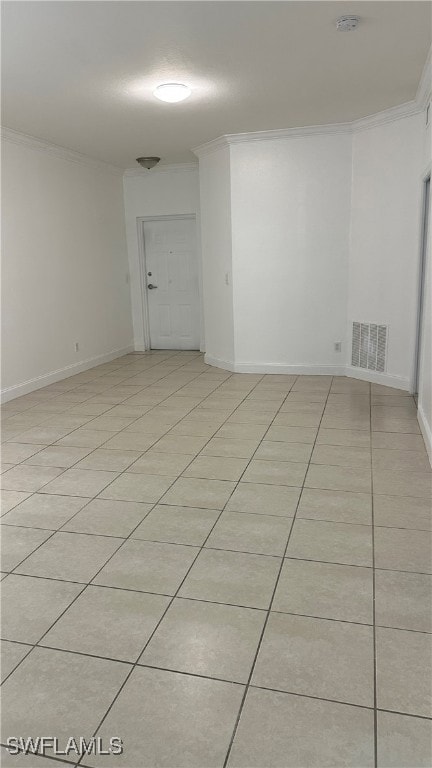Empty room with ornamental molding, a smoke detect