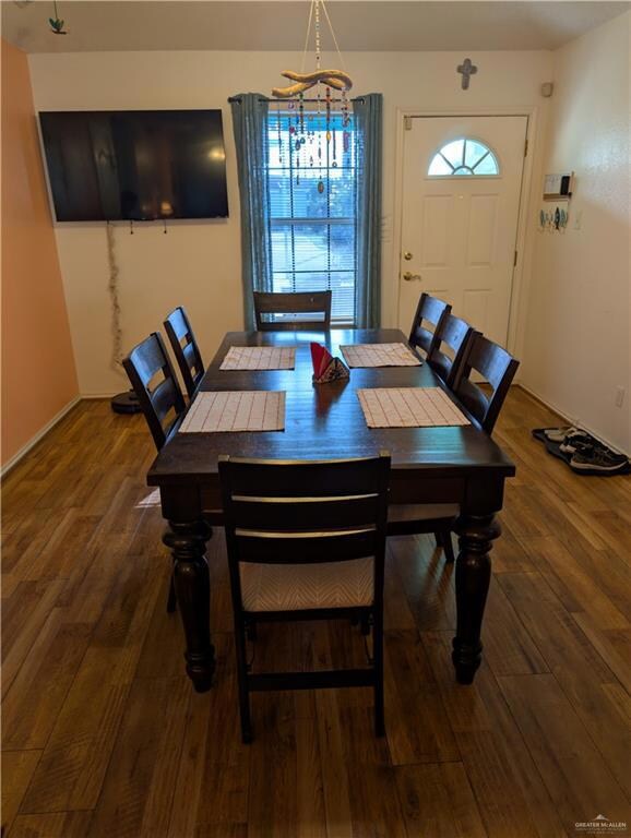 Dining area with wood-style flooring