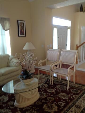 LIVING AREA SHOWING FRONT DOOR