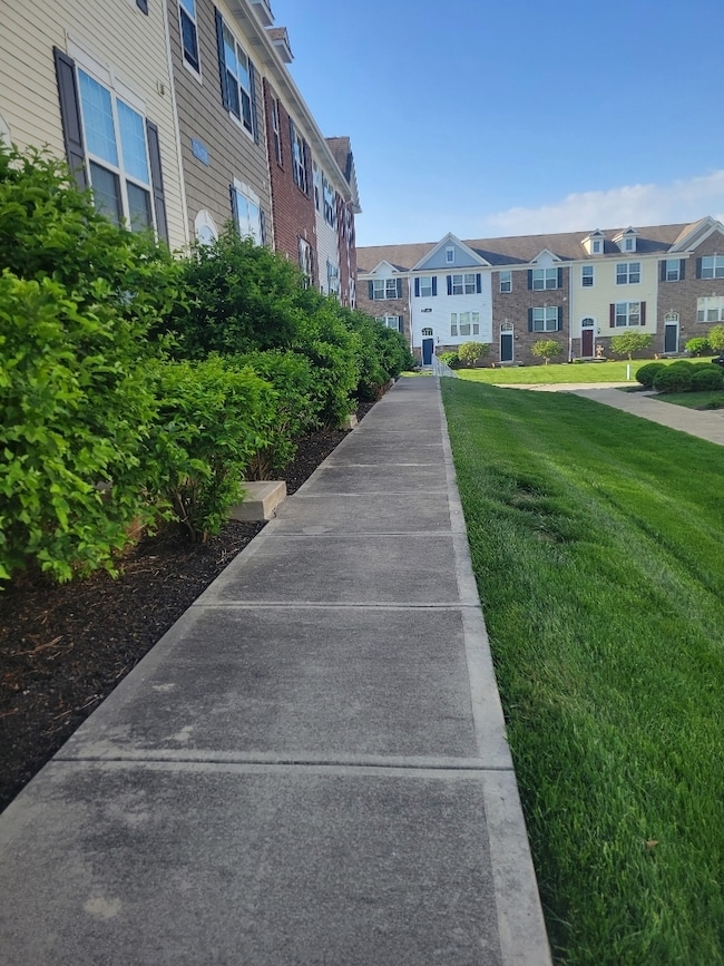 This townhome offers eastern & western exposure and grounds are  maintained by the HOA.