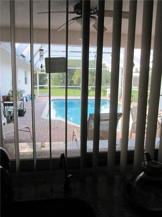 Window opens to pool area for all your entertainin