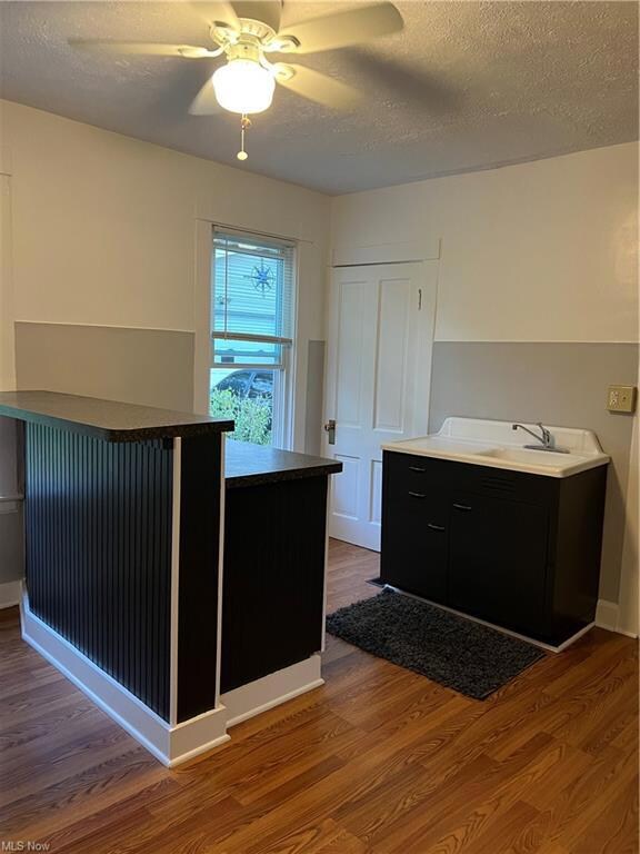 Kitchen 14 x 11 with laminate flooring.