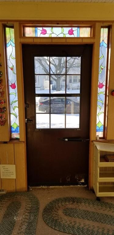 Front Porch door framed with stained glass