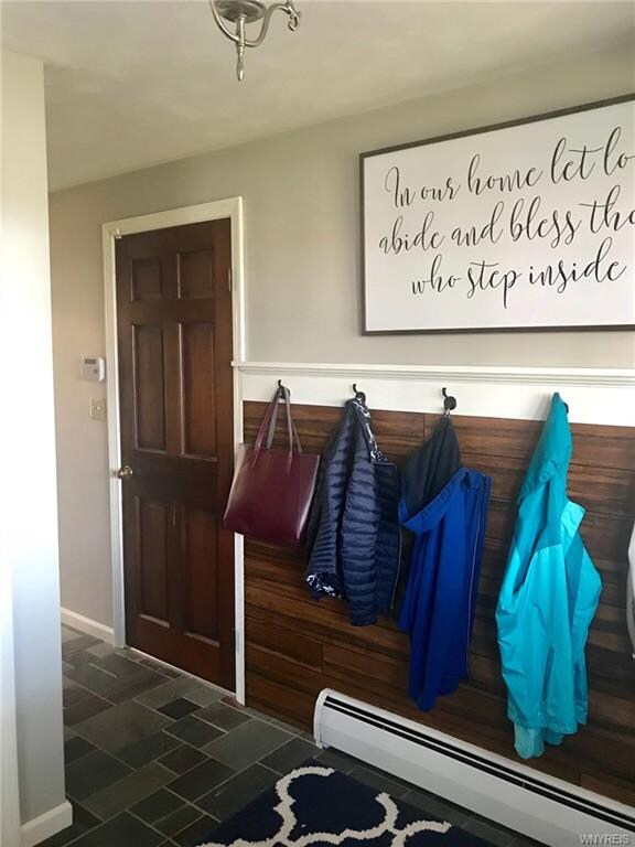 Large slate tile foyer greets you when you enter t