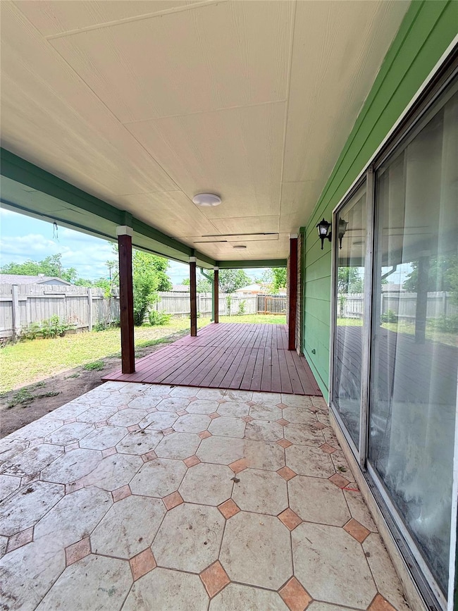 Fenced backyard with a patio area