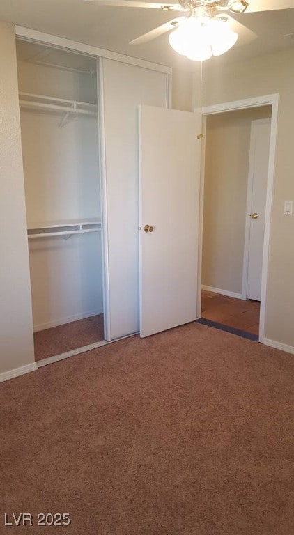 Unfurnished bedroom with light colored carpet, a ceiling fan, and a closet