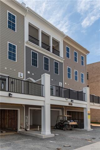 Rear of home, showing covered terrace and deck wit