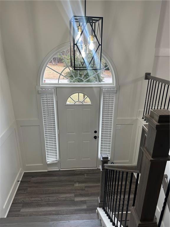 Entrance foyer featuring dark hardwood / wood-styl