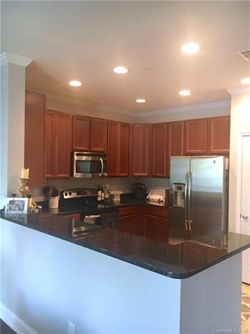 View from dining area. Granite counter tops.