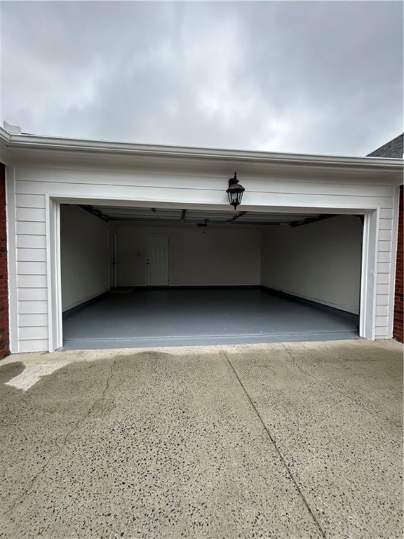 Garage with concrete driveway