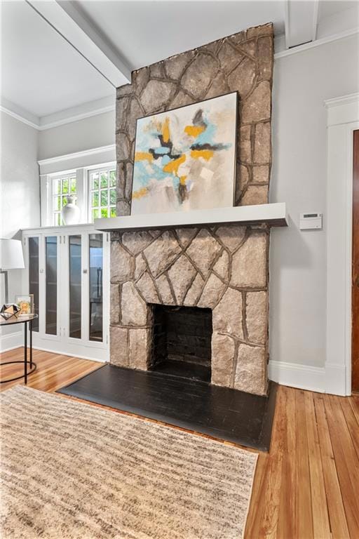 Granite fireplace hearth with original glassed-in bookshelves