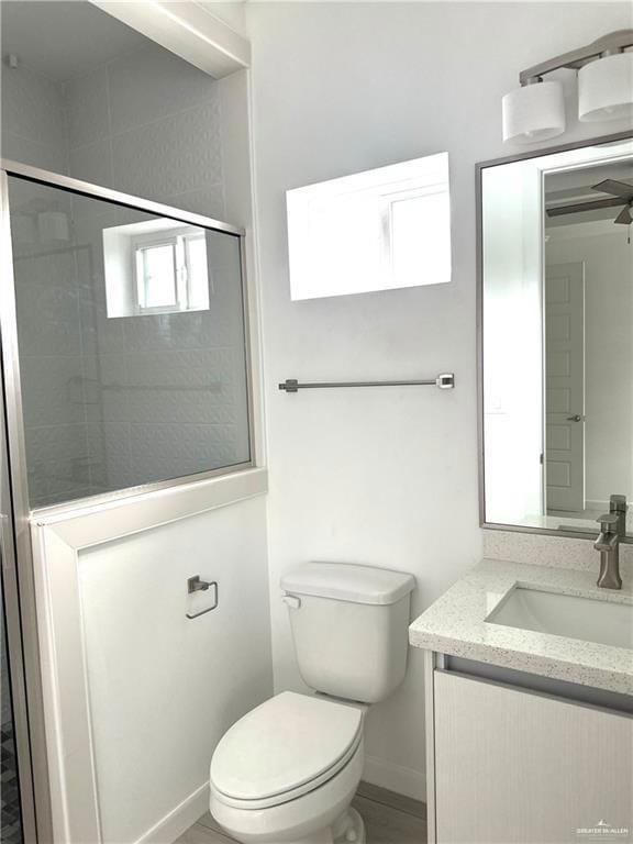 Bathroom featuring vanity and a stall shower