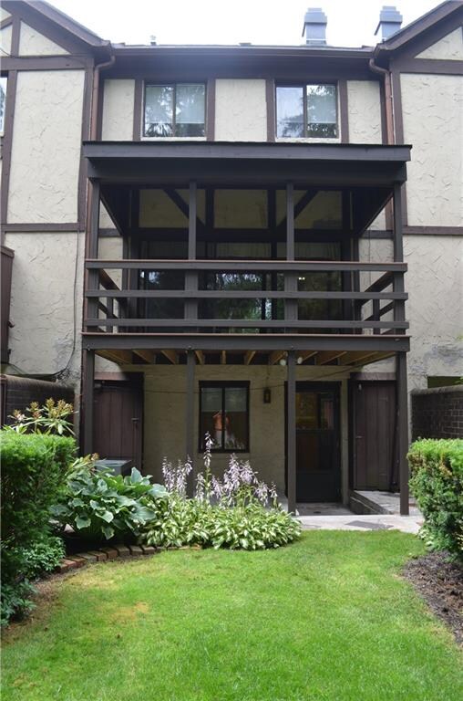 Large covered back deck provides wonderful indoor-