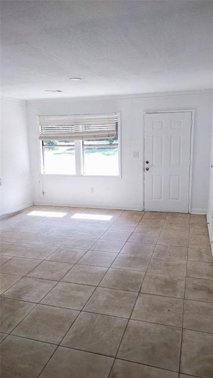 Tiled entryway with a wealth of natural light and 