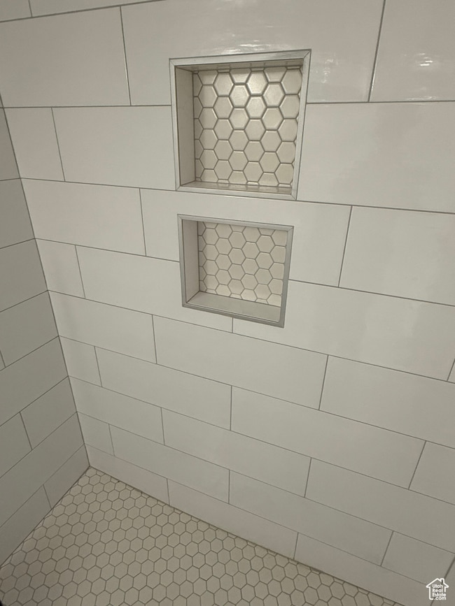 Bathroom featuring tiled shower