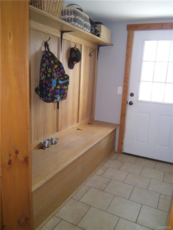 Rear entrance mud room with built in storage bench