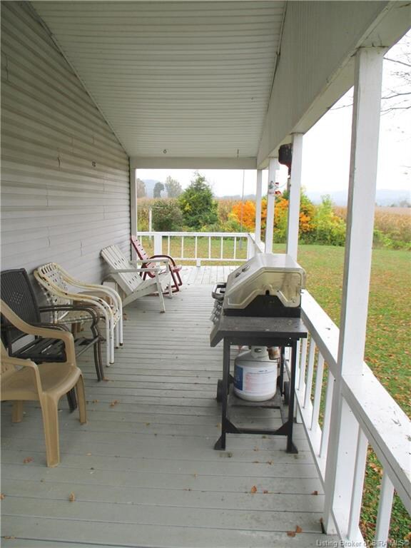 ENJOY THE RIVER VIEW FROM THE SIDE PORCH.