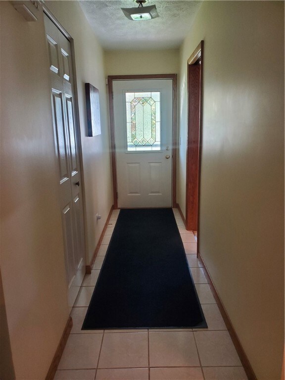 Tiled Entry way off Kitchen