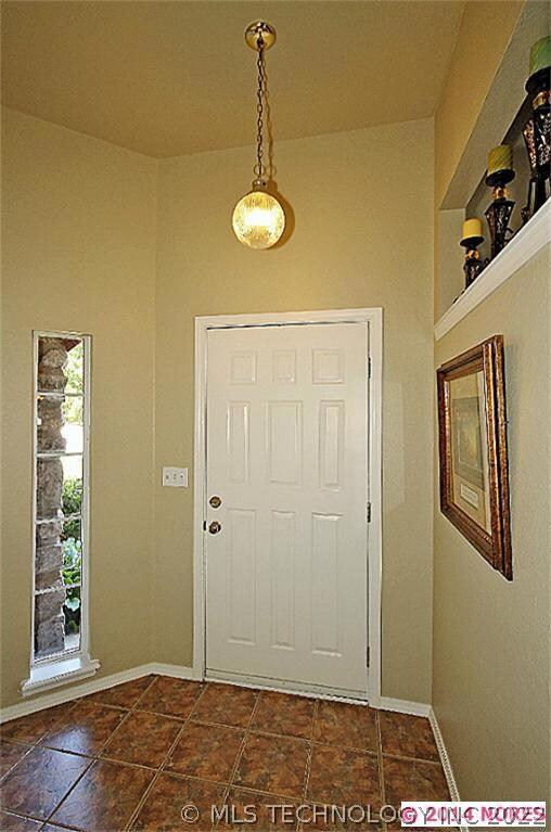 A ceramic tiled foyer greets you upon entry into t