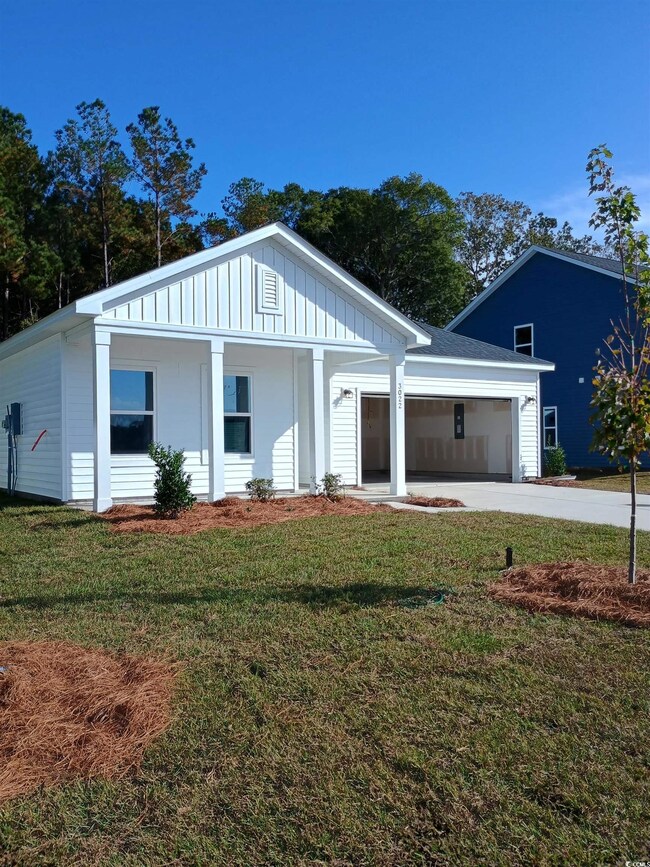 View of front of house featuring a garage and a fr