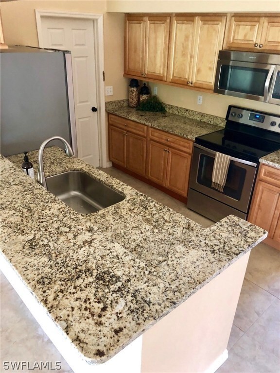 Upgraded granite makes a statement in this kitchen