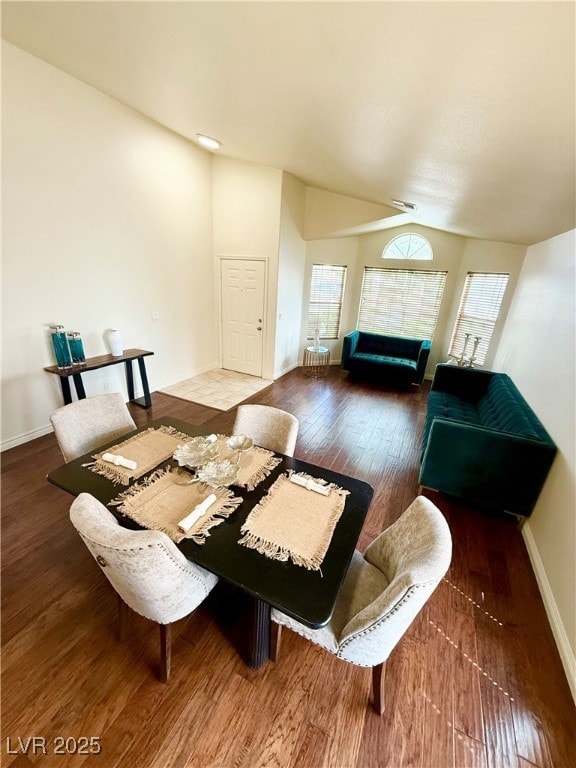 Dining space featuring wood finished floors, baseb
