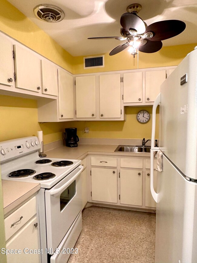 Kitchen with stove fridge