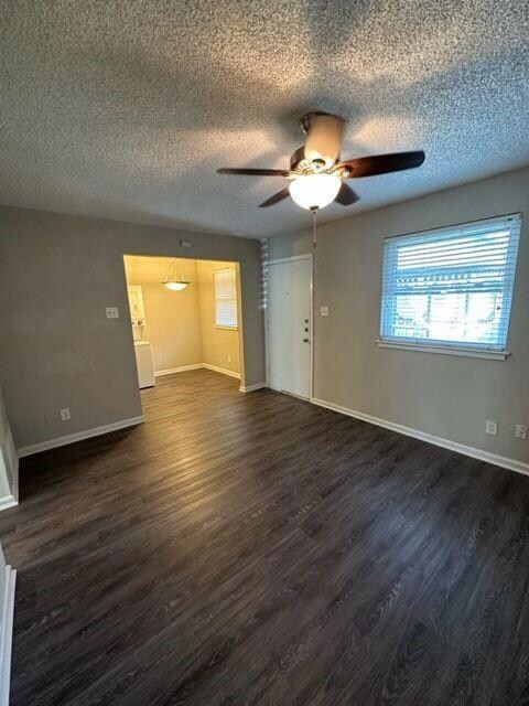 Spare room featuring baseboards, a textured ceili