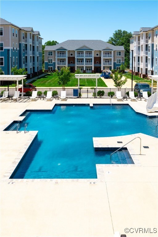 View of swimming pool featuring pool water feature