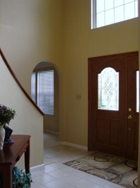 The two story entry features double entry doors, a