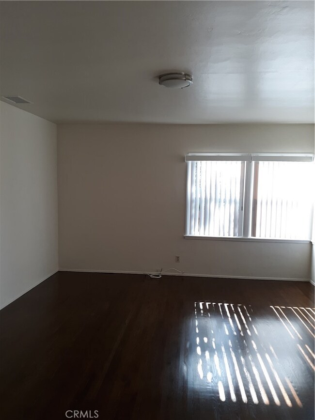 Spacious living room, refinished hardwood flooring 2019