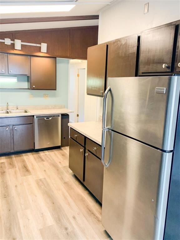 Upstairs kitchen w/stainless appliances and vinyl