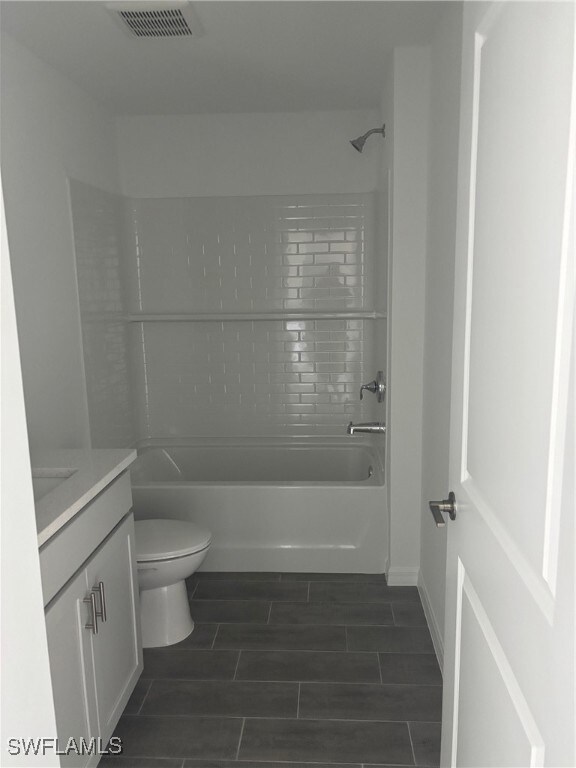 Full bathroom featuring vanity, wood finish floors