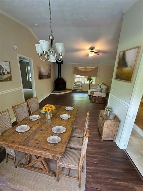 Dining space featuring a wood stove, wood finished
