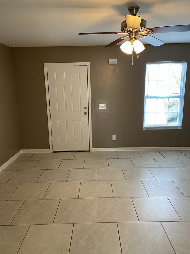 Large living room with ceramic tile floors,new blinds,new paint