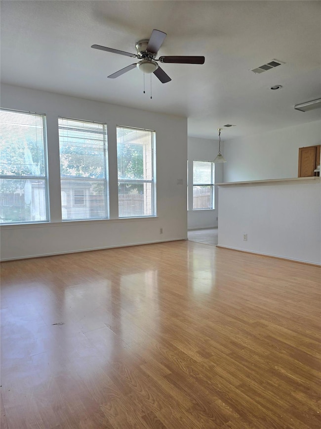Empty room featuring light wood-style flooring, a