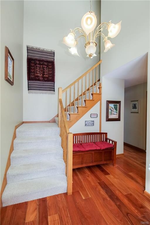 Stately, two-story foyer welcomes you and your gue