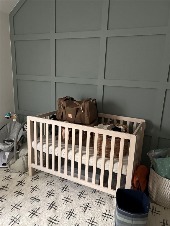 Bedroom with a decorative wall