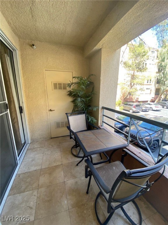 Balcony featuring visible vents