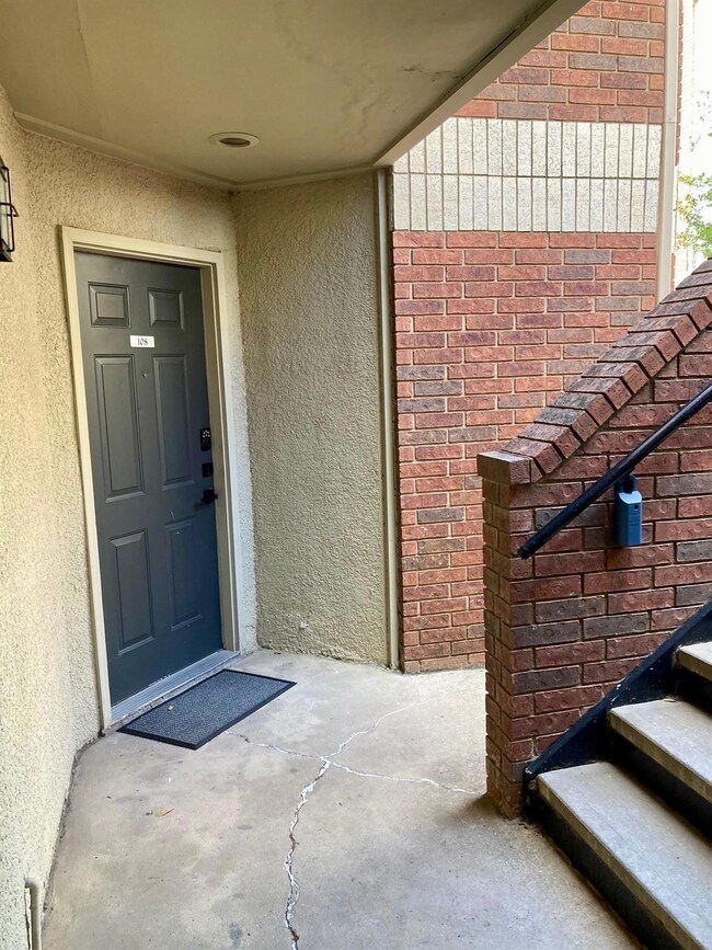 Adjacent stairway to upper unit.