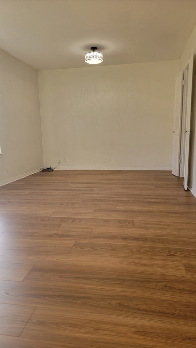Empty room featuring light wood-type flooring