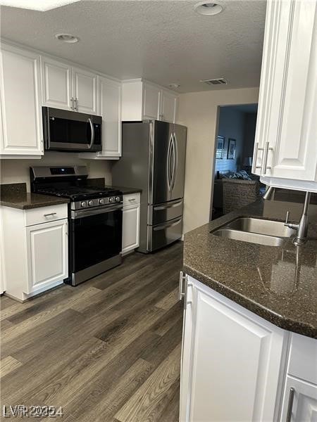 Kitchen featuring stainless steel appliances, a te